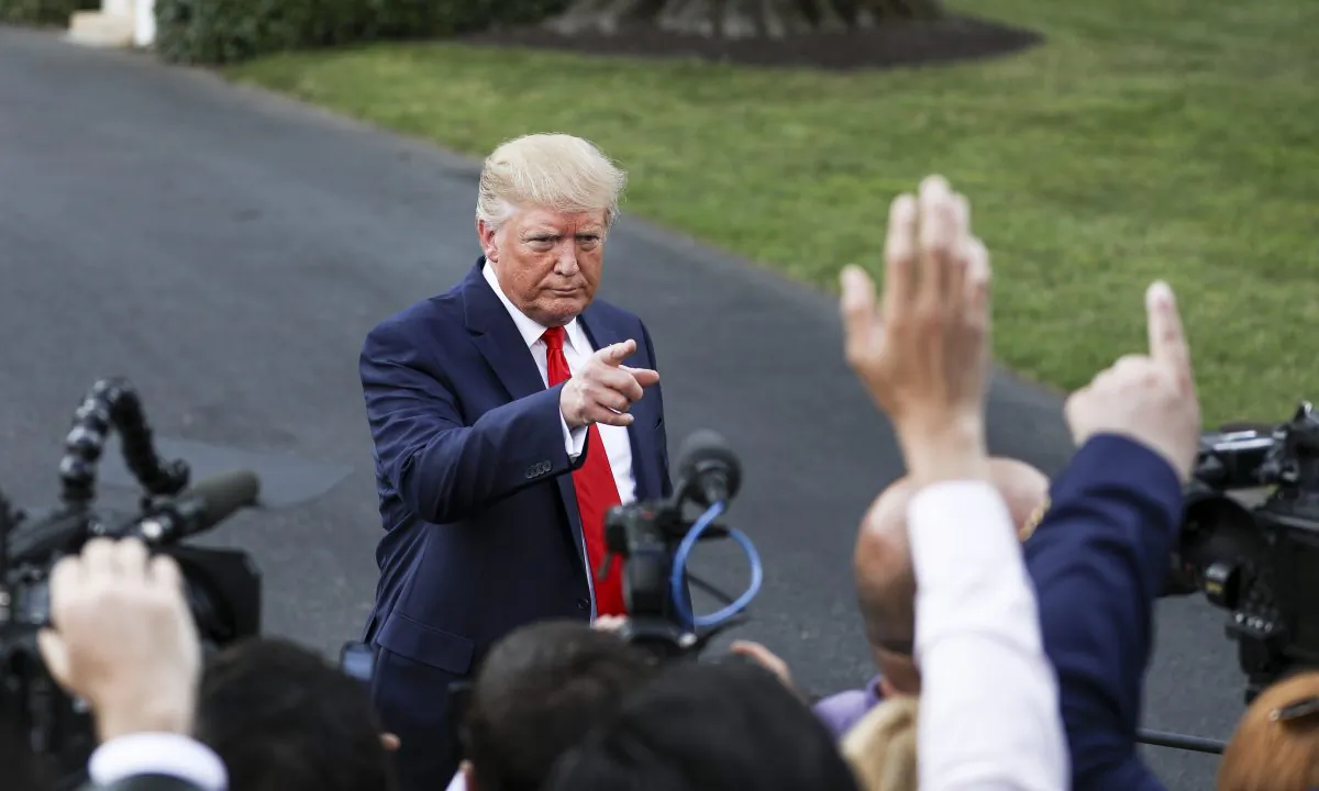 U.S. President Donald Trump speaks to the media before boarding Marine One en route to Ohio on the White House South Lawn in Washington on Aug. 1, 2019. (Charlotte Cuthbertson/The Epoch Times)
