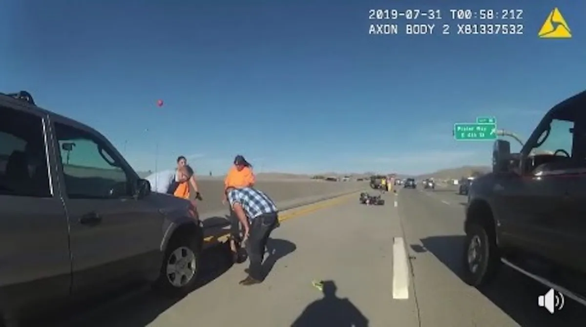 Road users helped lift an SUV off a trapped motorcyclist on the I-80 in Nevada on July 31. (Nevada Highway Patrol) 