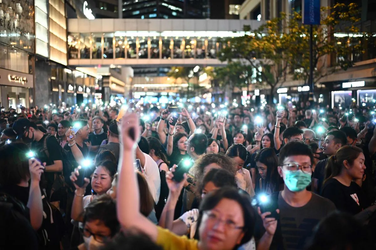 People attend a protest held by civil servants in the Central District of Hong Kong on Aug. 2, 2019. (Anthony Wallace/AFP/Getty Images)