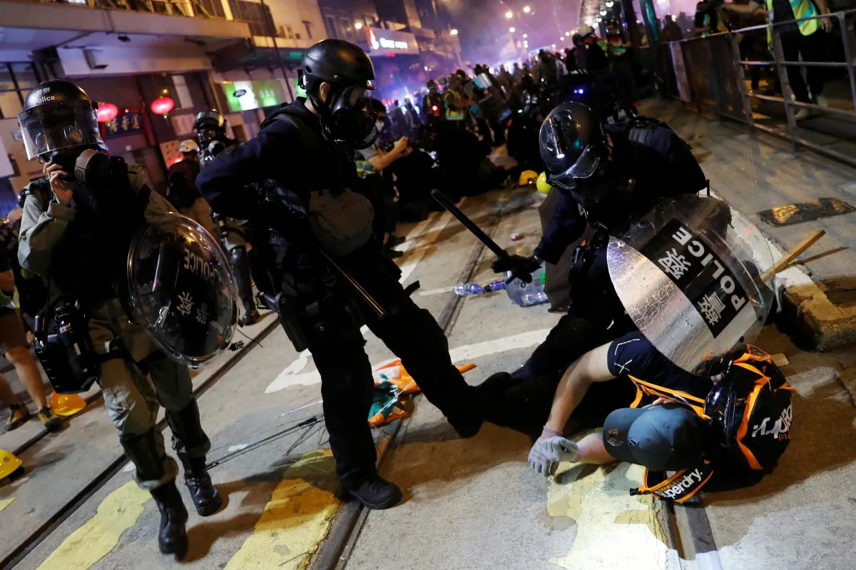 Riot police detains a demonstrator during a protest against police violence in Hong Kong, China July 28, 2019. (Reuters/Tyrone Siu)
