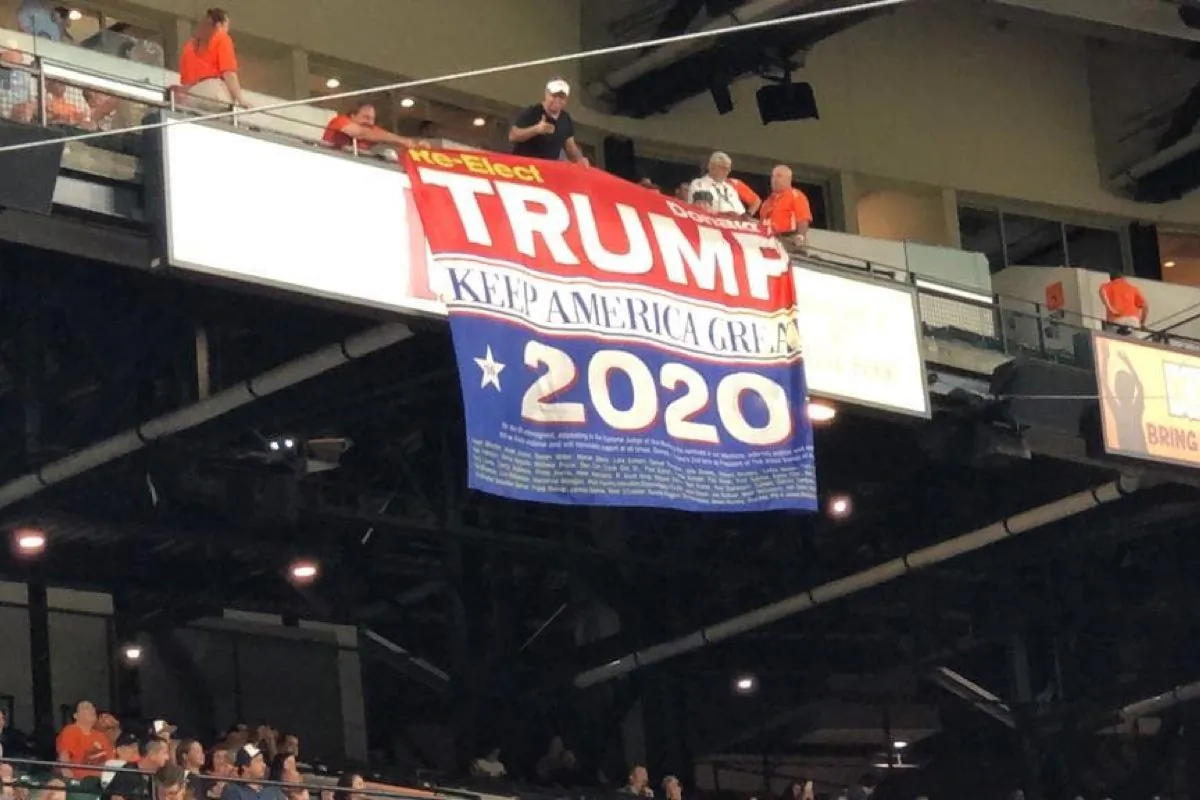Trump Supporters display huge re-elect Trump 2020 "Keep America Great" banner at the Baltimore Orioles game at Camden Yards in Baltimore, Md., on Aug. 1, 2019. (Courtesy of Dion Cini)