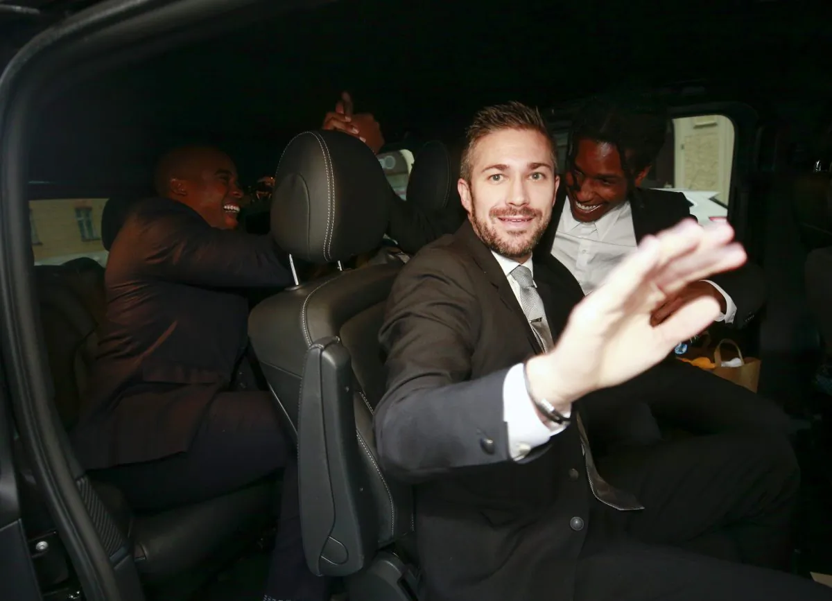 A$AP Rocky (R) leaves the district court after the third day of his trial in Stockholm, Sweden, on Aug. 2, 2019. (Fredrik Persson/TT News Agency via AP)