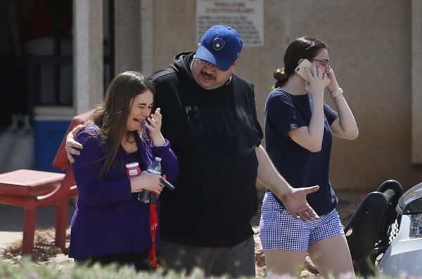 People arrive at MacArthur Elementary