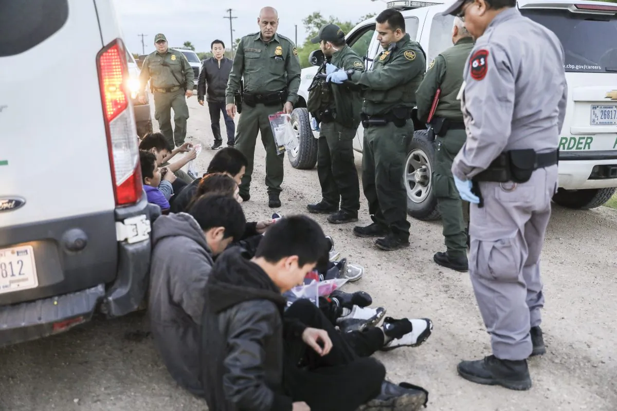 Border Patrol agents apprehend seven illegal immigrants from China, one from Mexico, and one from El Salvador after they tried to evade capture after crossing the Rio Grande from Mexico into the United States near McAllen, Texas, on April 18, 2019. (Charlotte Cuthbertson/The Epoch Times)