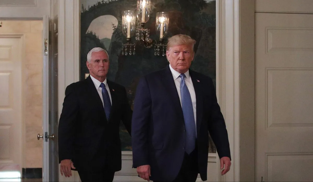 President Donald Trump and Vice President Mike Pence enter the Diplomatic Reception Room of the White House to make remarks in Washington on Aug. 5, 2019. (Alex Wong/Getty Images)