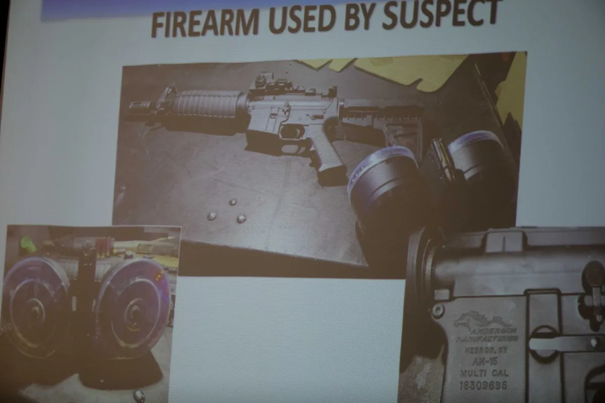 The firearm used by the shooter Connor Betts, 22, is projected on a screen during a press conference about a mass shooting that left left multiple people dead and 26 injured along the 400 block of E. Fifth Street, in Dayton, Ohio, on Aug. 4, 2019. (Albert Cesare/The Cincinnati Enquirer via AP)