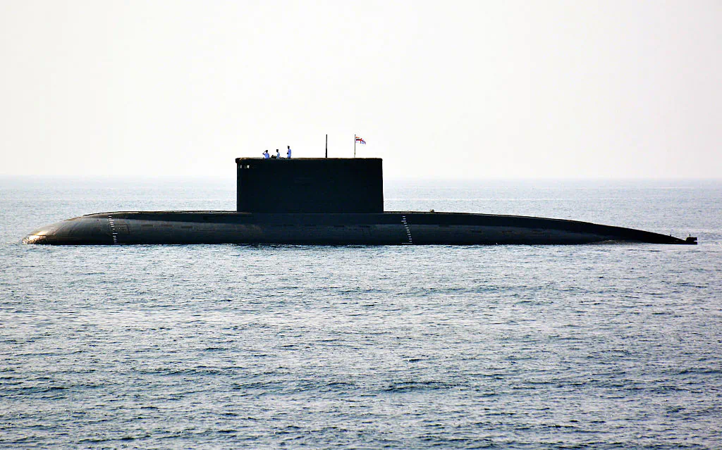 Indian Navy personnel stand on an Indian Navy submarine during the International Fleet Review in Visakhapatnam, India, on Feb. 6, 2016. (STR/AFP/Getty Images)