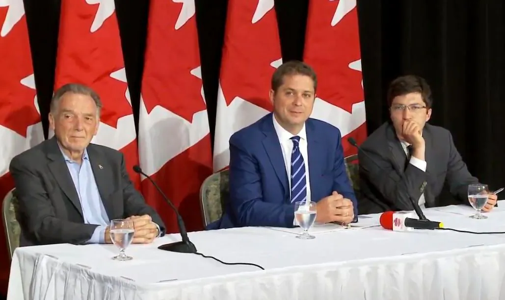 (L-R) Conservative MP Peter Kent, Conservative Leader Andrew Scheer, and Conservative MP Garnett Genuis during a roundtable Q&A with ethnic media reporters in Etobicoke, Ont., on Aug. 2, 2019. (Arek Rusek/NTD Television)