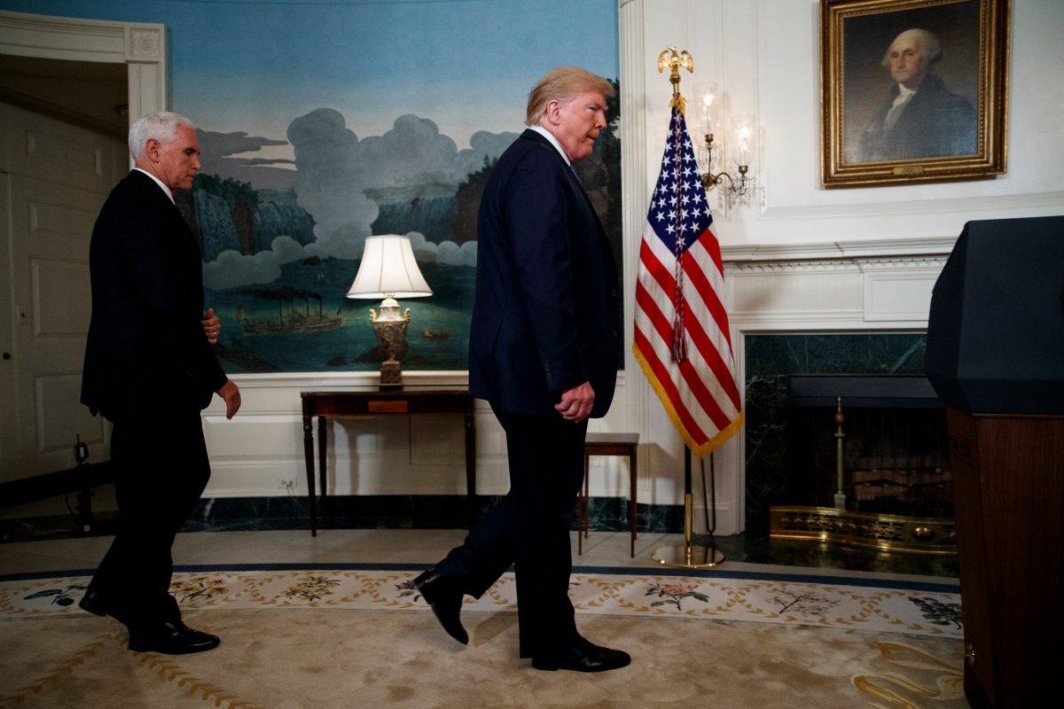 Vice President Mike Pence follows President Donald Trump 