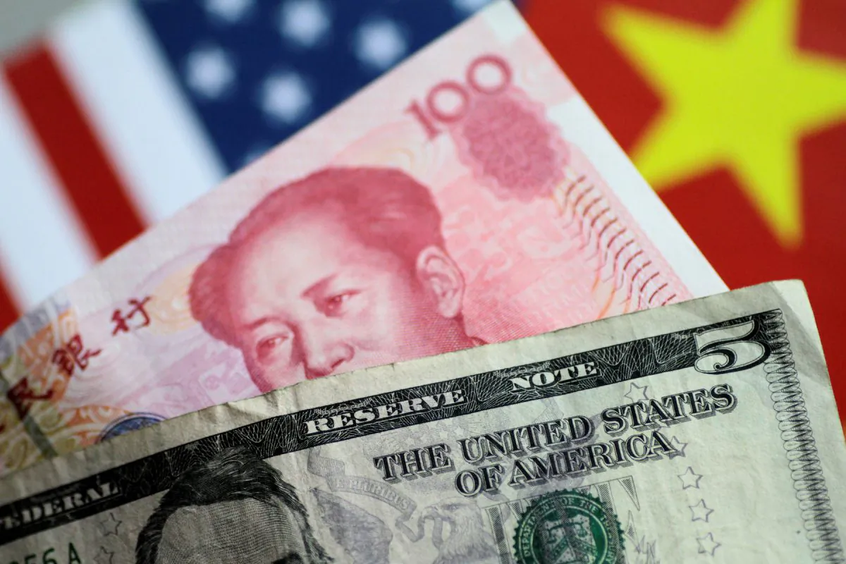 U.S. Dollar and China Yuan notes on a picture illustration on June 2, 2017. (Reuters/Thomas White/Illustration/File Photo)