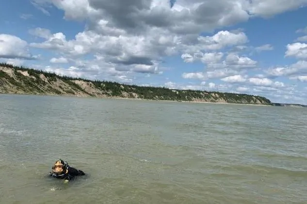 The RCMP Underwater Recovery Team completes their work following the discovery of a boat on the shore of the Nelson River, northeast of Gillam, MB. in this handout photo provided August 5, 2019. (HO, RCMP/The Canadian Press)