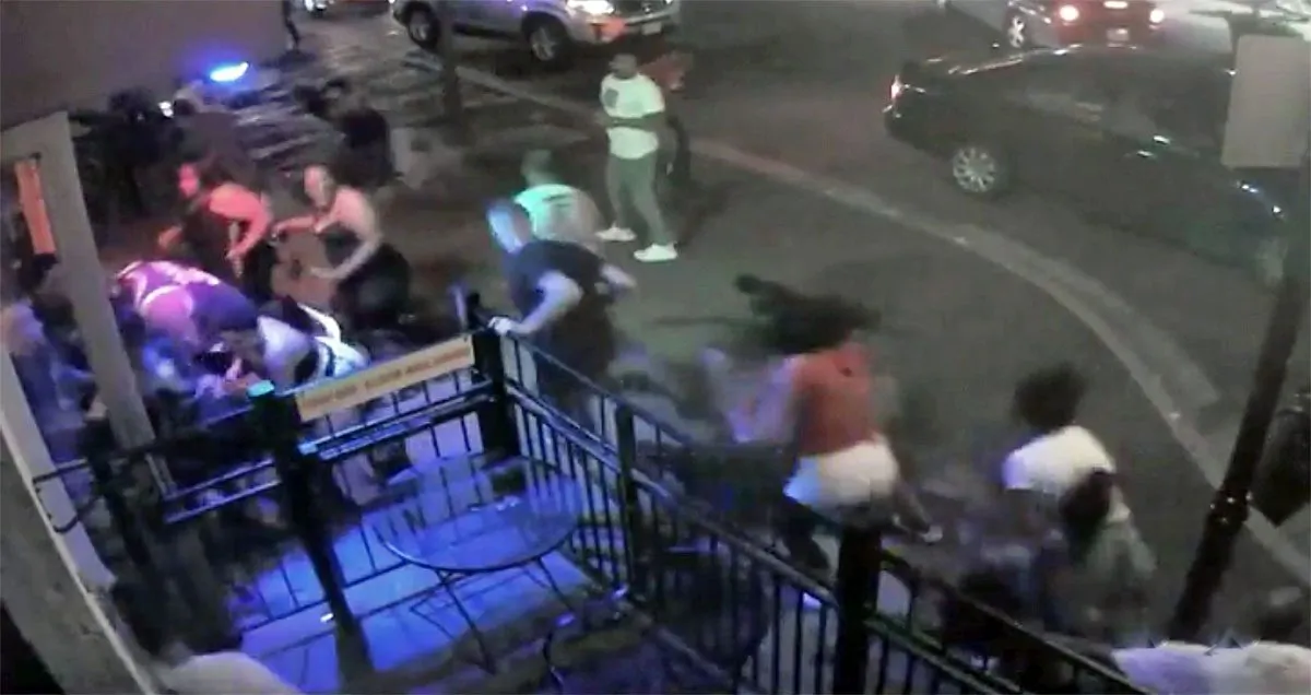 People try to escape a mass shooting outside of Ned Peppers in Dayton, Ohio, on Aug. 4, 2019. (Dayton City Handout via Reuters)