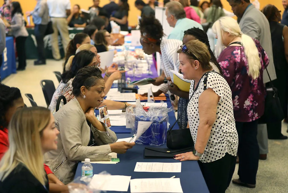 People attend a job fair in Miami, Fla., on April 5, 2019. (Joe Raedle/Getty Images)