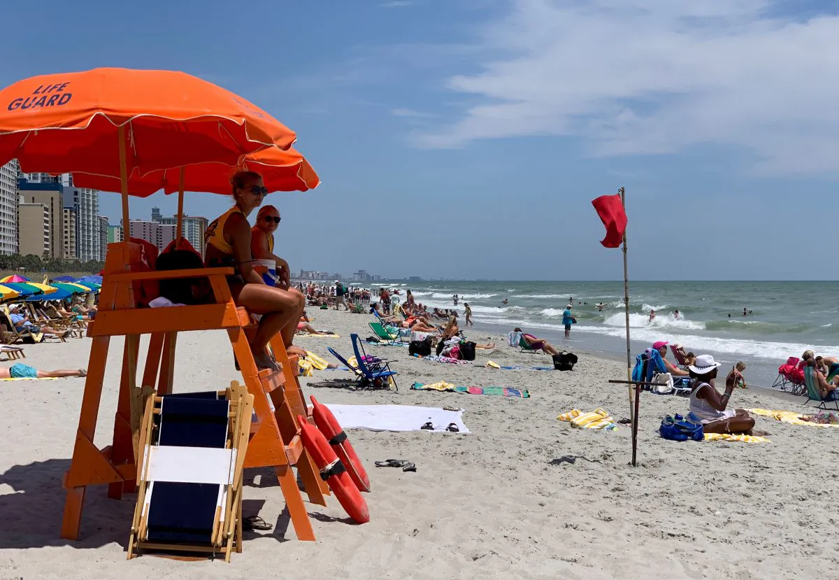 Lifeguards watch people enjoying the beach on a hot summer day in Myrtle Beach, S.C., on July 27, 2019. (Daniel Slim/AFP/Getty Images)