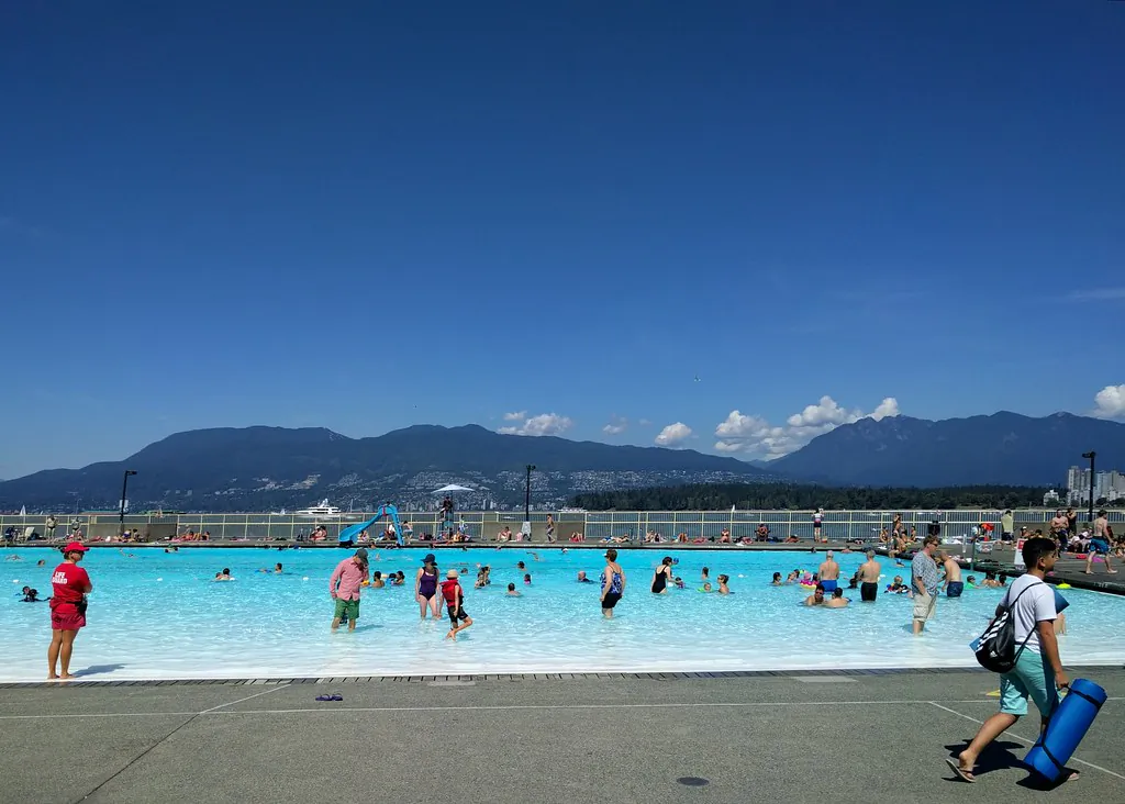 People beat the heat at a swimming pool. (Ruth Hartnup/Flickr)