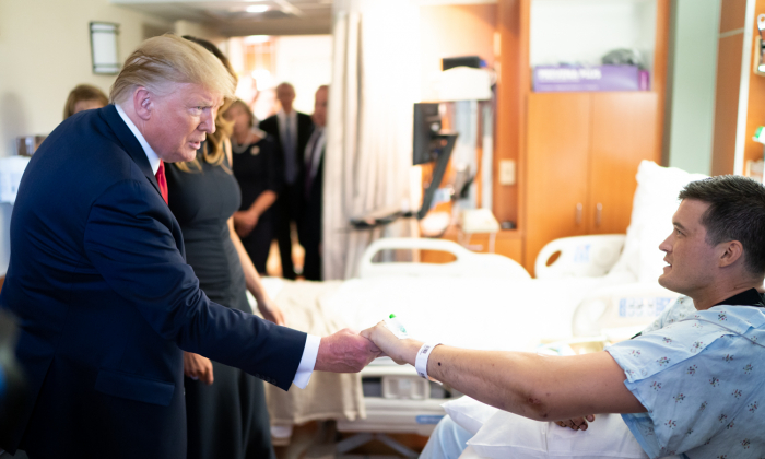 President Donald Trump and First Lady Melania Trump meet with a survivor of the Dayton shooting massacre at Miami Valley Hospital in Dayton, Ohio, on Aug. 7, 2019.  (Official White House Photo by Andrea Hanks)