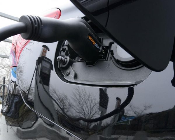 A car is charged at a charge station for electric vehicles on Parliament Hill in Ottawa on May 1, 2019. Transport Canada data shows more than 14,000 electric vehicles were purchased in Canada during the first three months of the federal government's new rebate program. (Sean Kilpatrick/The Canadian Press)