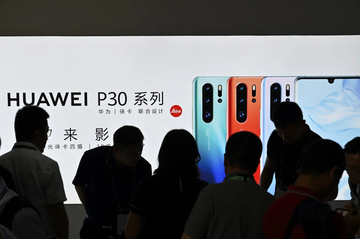 People visit a Huawei stand during the Mobile World Congress introducing next-generation technology at the Shanghai New International Expo Centre(SNIEC) in Shanghai on June 26, 2019. (Hector Retamal/AFP/Getty Images)