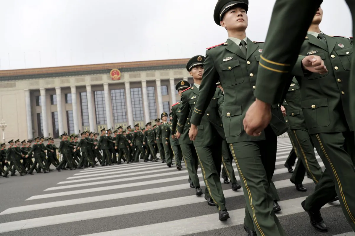 Chinese paramilitary policemen march outside the Great Hall of the People after attending a ceremony to commemorate the 90th anniversary of the founding of the People's Liberation Army, in Beijing on August 1, 2017.
China will fiercely protect its sovereignty against "any people, organisation or political party", President Xi Jinping warned on August 1, as the country celebrated the 90th anniversary of its military, the People's Liberation Army. / AFP PHOTO / POOL / Andy WONG        (Photo credit should read ANDY WONG/AFP/Getty Images)