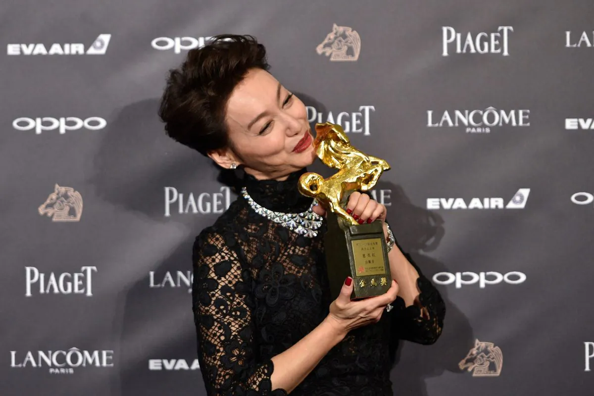 Hong Kong actress Kara Hui Ying-hung, also known as Kara Wai, poses after winning the Best Leading Actress Award for her film "The Bold, the Corrupt, and the Beautiful" at Taiwan's 54th Golden Horse film awards, dubbed the Chinese "Oscars", in Taipei on November 25, 2017. (SAM YEH/AFP/Getty Images)