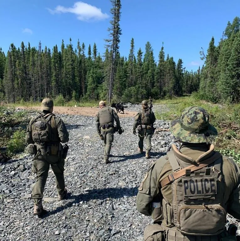 RCMP search an area near Gillam, MB in this photo posted to their Twitter page on July 30, 2019. (Twitter, Manitoba RCMP, The Canadian Press)