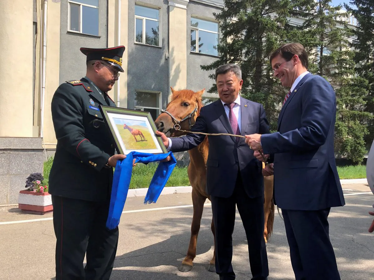 U.S. Secretary of Defense Mark Esper is gifted a horse in Ulan Bator, Mongolia on Aug. 8, 2019. (Idrees Ali/Reuters)