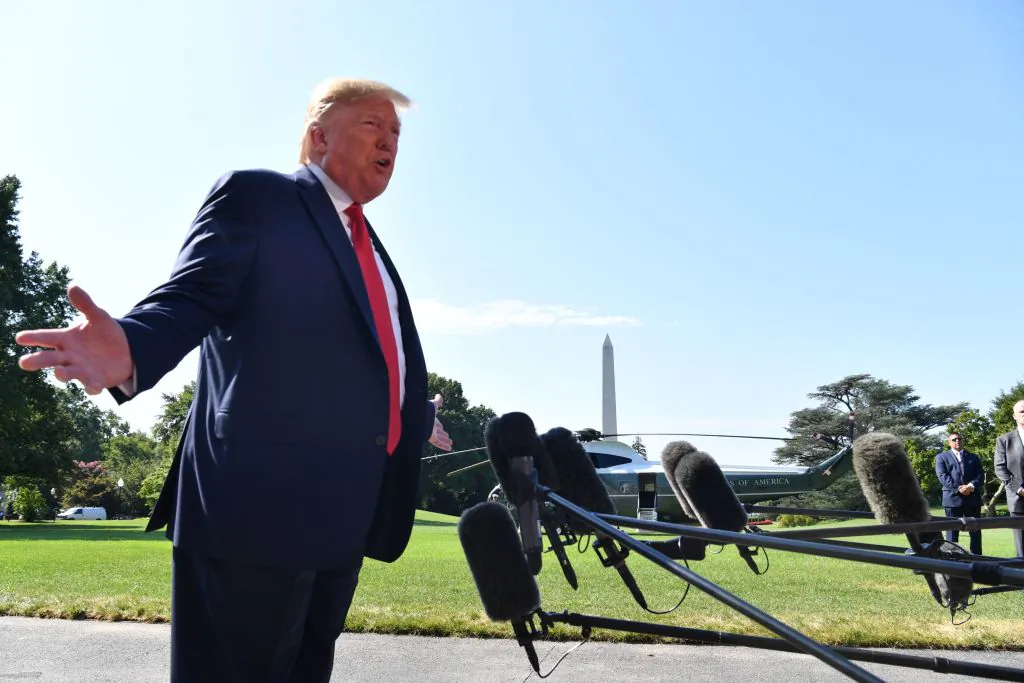 President Donald Trump speaks to the press on the South Lawn of the White House before departing in Washington on Aug. 9, 2019.(NICHOLAS KAMM/AFP/Getty Images)