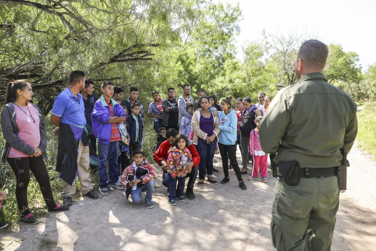 Border Patrol agent Carlos Ruiz apprehends 35 illegal aliens who have just crossed the Rio Grande from Mexico near McAllen, Texas, on April 18, 2019. (Charlotte Cuthbertson/The Epoch Times)