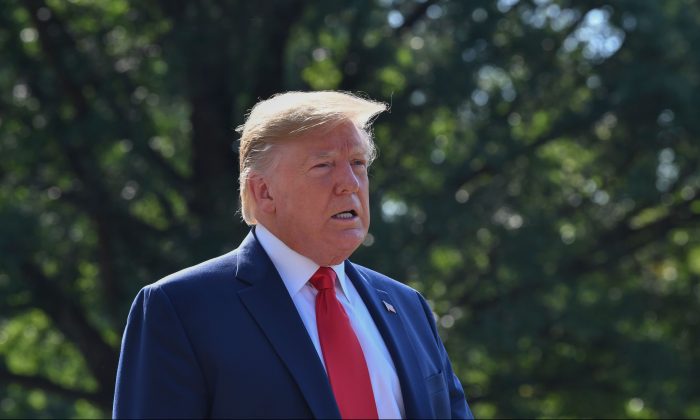 President Donald Trump speaks to the press on the South Lawn of the White House before departing in Washington on Aug. 9, 2019. (Nicholas Kamm/AFP/Getty Images)
