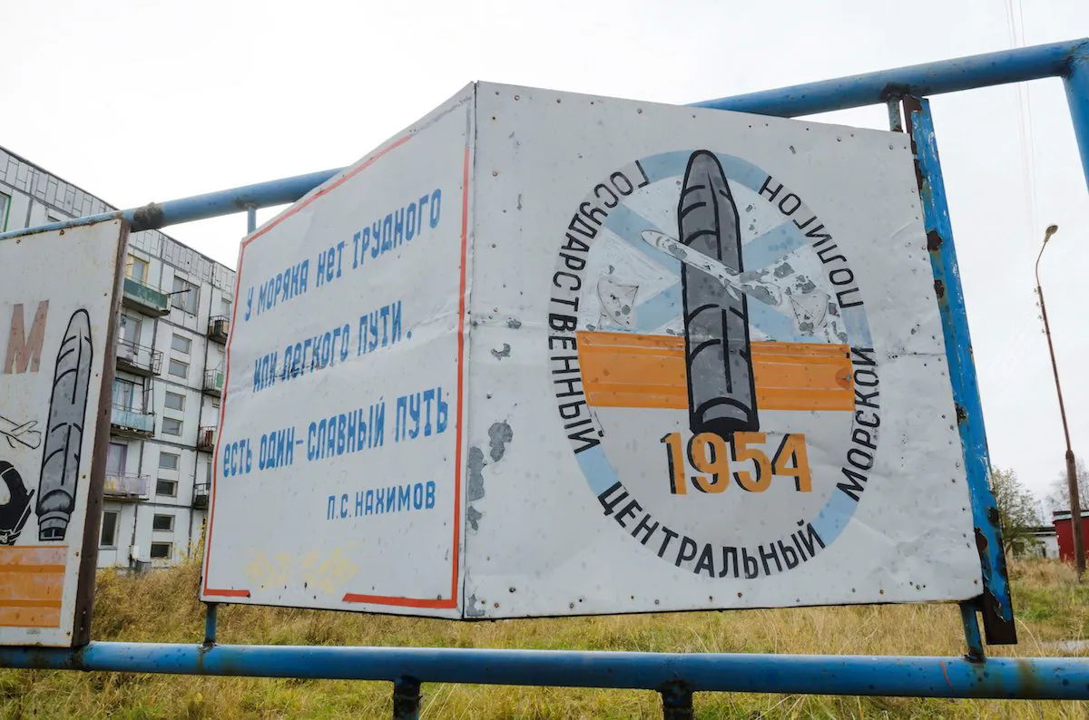 A view shows a board on a street of the military garrison located near the village of Nyonoksa in Arkhangelsk Region, Russia, on Oct. 7, 2018. The board reads: "State Central Naval Range". (REUTERS/Sergei Yakovlev)