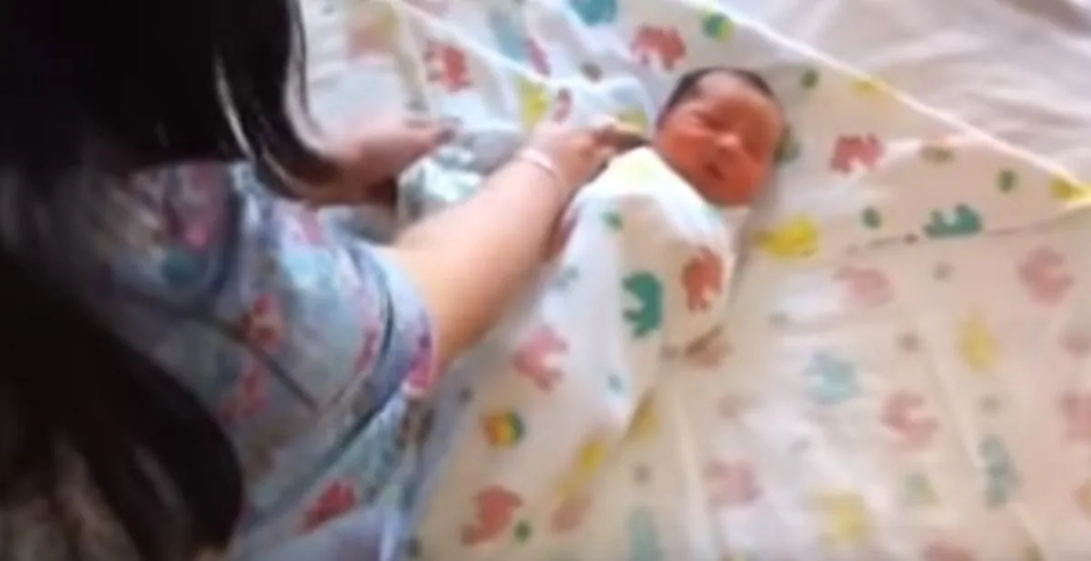 A "double"-swaddled baby (YouTube)