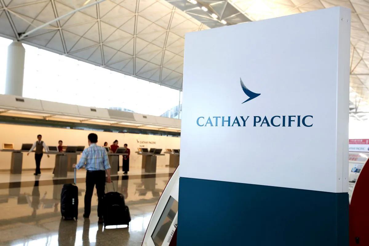 A passenger walks to the First Class counter of Cathay Pacific Airways at Hong Kong Airport in Hong Kong, China on April 4, 2018. (Bobby Yip/Reuters)
