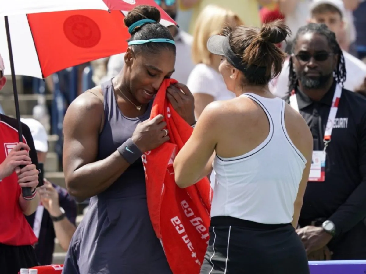 Serena Williams (L) dries her eyes with a towel after withdrawing in the championship match against Bianca Andreescu during the Rogers Cup tennis tournament at Aviva Centre in Toronto, Canada, on Aug. 11, 2019. (John E. Sokolowski/USA TODAY Sports)