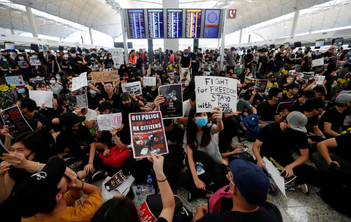 Anti-extradition bill demonstrators attend a protest at the departure hall of Hong Kong Airport, China on Aug.12, 2019. (Issei Kato/Reuters)
