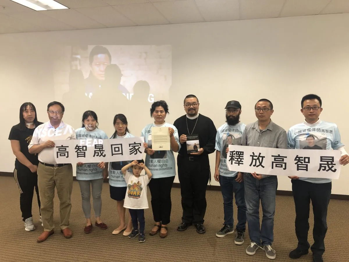 Members of CCFOR holding signs in Chinese stating, "Free Gao Zhisheng" and "Let Gao Zhisheng Go Home" during the news conference on August 11, 2019. (Nathan Su/Epoch Times)