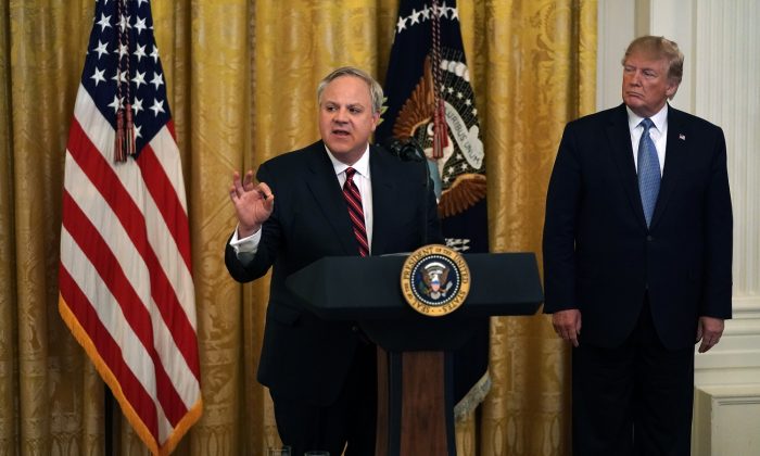 Secretary of Interior David Bernhardt (L) speaks as President Donald Trump (R) looks on during an East Room event on the environment at the White House in Washington on July 7, 2019.  (Alex Wong/Getty Images)