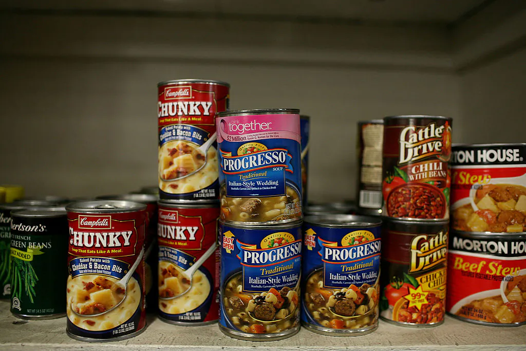 Canned food that will be packed into boxes for needy families is seen on a packing table at the Alameda County Community Food Bank in Oakland, Calif., on Dec. 18, 2008. (Justin Sullivan/Getty Images)