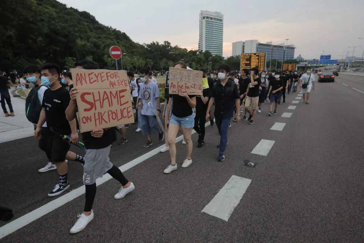 Protesters walk on a highway near Hong Kong's international airport following a protest against the police brutality and the controversial extradition bill on Aug. 12, 2019.         (Vivek Prakash/AFP/Getty Images)