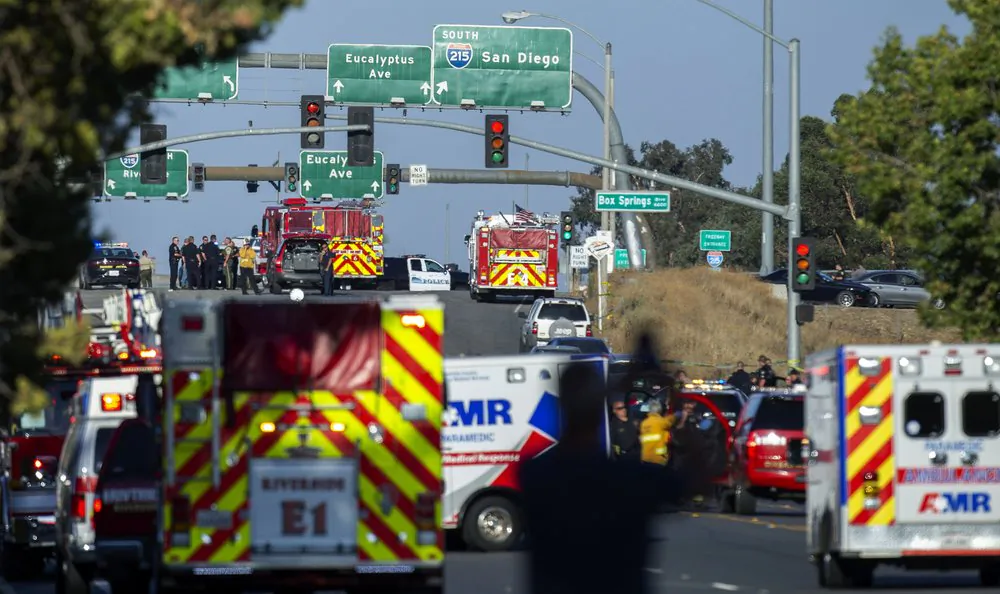 Authorities work on a scene in Riverside, Calif., on Aug. 12, 2019. (Terry Pierson/The Orange County Register via AP)