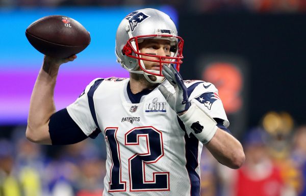 Tom Brady #12 of the New England Patriots attempts a pass against the Los Angeles Rams in the first quarter during Super Bowl LIII
