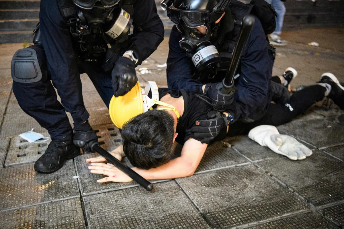Police arrest a man during protests in Tsim Sha Tsui in Hong Kong on Aug. 11, 2019. (Anthony Wallace/AFP/Getty Images)