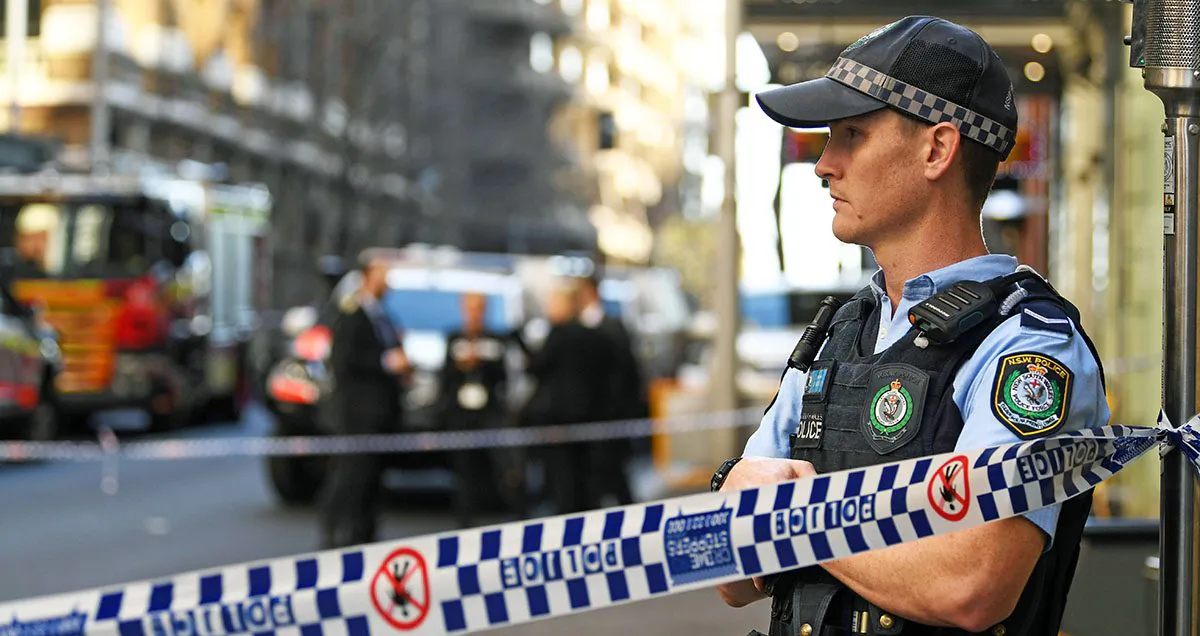 A New South Wales Police officer at a crime scene  in Sydney, Australia, on Aug. 13, 2019. (Saeed Khan/AFP/Getty Images)