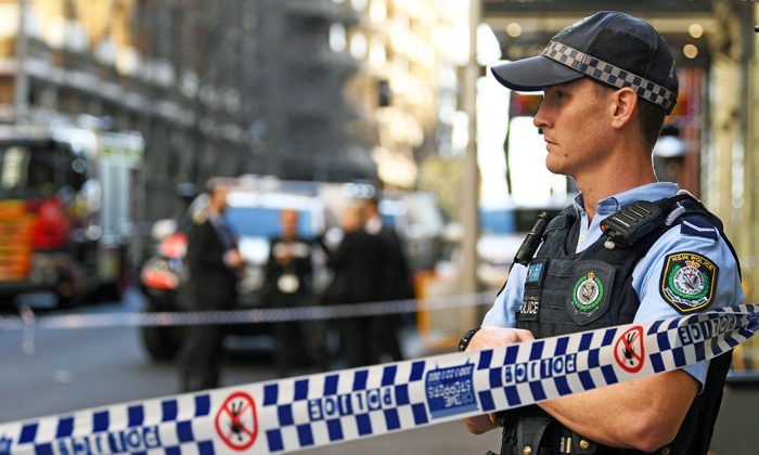 A New South Wales Police officer at a crime scene  in Sydney, Australia, on Aug. 13, 2019. (Saeed Khan/AFP/Getty Images)