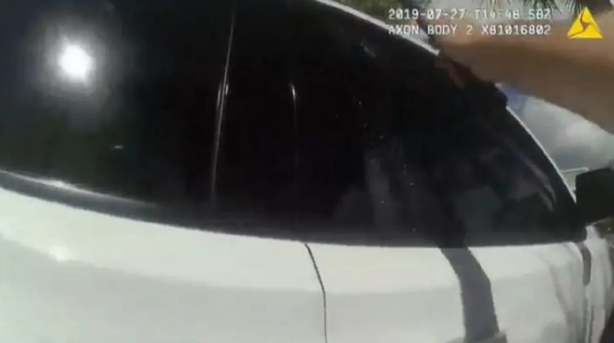 A police officer broke a car window in Florida. (Stuart Police Department)