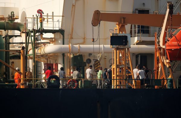 Crew members are pictured as Iranian oil tanker Grace 1 sits anchored awaiting a court ruling on whether it can be freed