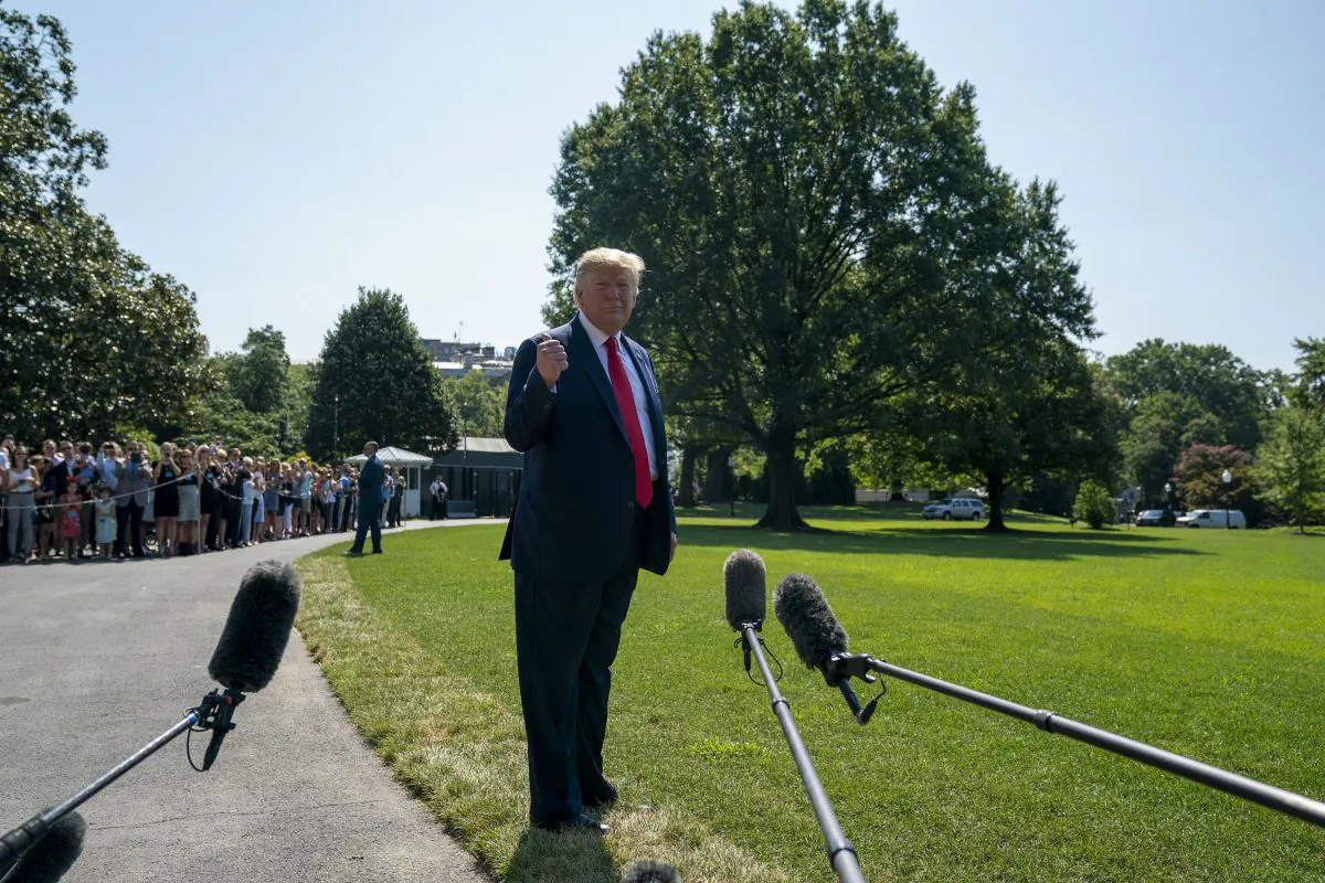 President Donald Trump speaks to members of the press before departing from the White House on the south lawn before he boards Marine One in Washington on Aug. 9. (Tasos Katopodis/Getty Images)