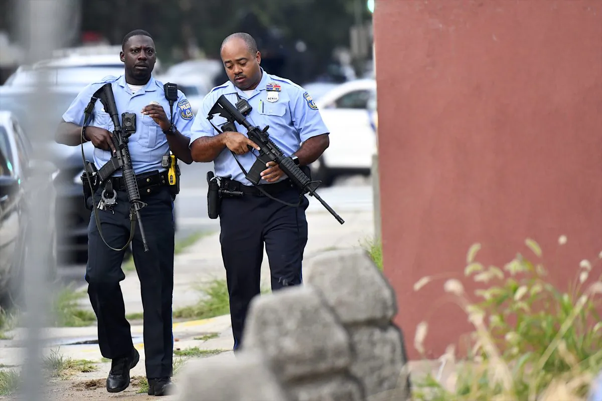 Police officers carrying assault rifles respond to a shooting in Philadelphia, Pa., on Aug. 14, 2019. (Mark Makela/Getty Images)