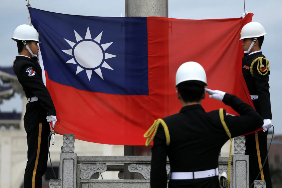 Military honor guards attend a flag-raising ceremony at Chiang Kai-shek Memorial Hall, in Taipei, Taiwan on March 16, 2018. (Tyrone Siu/Reuters)