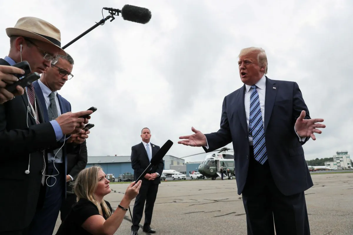 President Donald Trump talks to reporters as he boards Air Force One for travel to Pennsylvania from Morristown Municipal Airport in Morristown, New Jersey, U.S. on Aug. 13, 2019. (Reuters/Jonathan Ernst/File Photo)