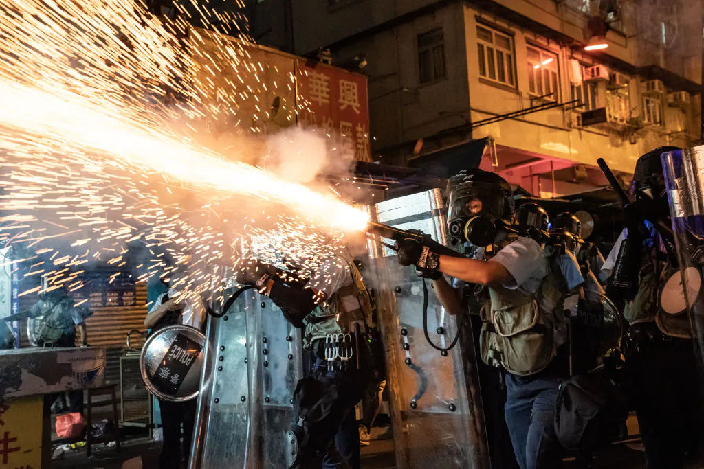 Police fire tear gas to clear pro-Democracy protesters during a demonstration on Hungry Ghost Festival day in the Sham Shui Po district in Hong Kong on Aug. 14, 2019. (Anthony Kwan/Getty Images)